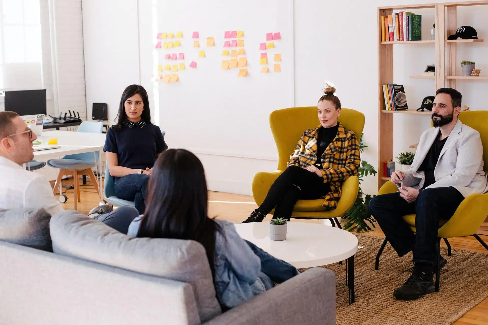 A group of people in an office having a meeting