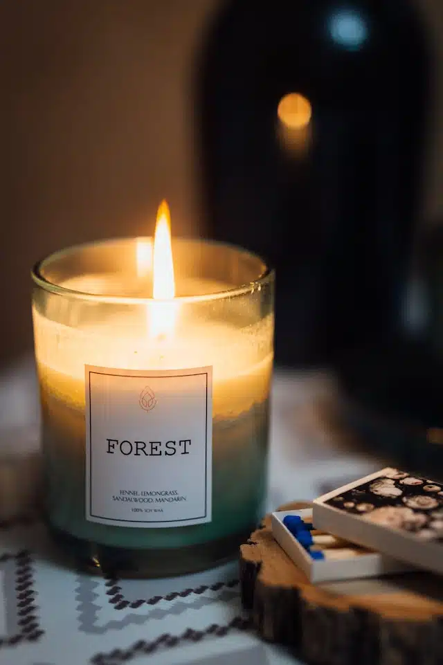 forest scented green candle on table